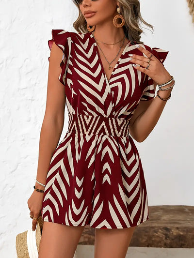 Alona – Schicker Strampler mit Chevron-Muster und Flügelärmeln